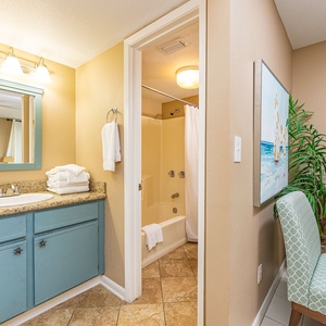 Granite countertop and fresh towels prepare your master bath for relaxing showers after active days on the coast