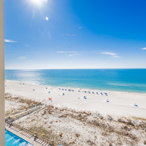 Inviting shoreline and sparkling waters from your balcony, perfect for relaxation and enjoyment