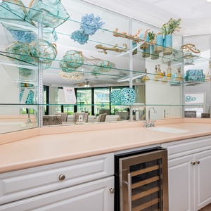 Grab a chilled bottle from the wine cooler or create your favorite cocktail at the wet bar