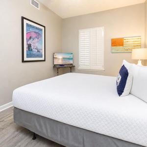 Cozy up in this queen guest suite while streaming your favorite shows in this inviting bedroom retreat