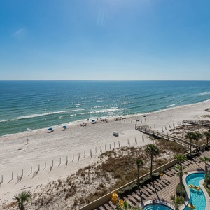 Gaze at the gentle waves from your balcony, feeling the warmth of the sun on your skin as you embrace coastal tranquility