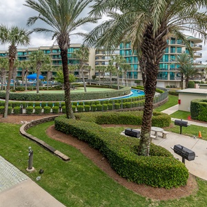 Discover the refreshing pool area with an inviting lazy river and thrilling waterslide