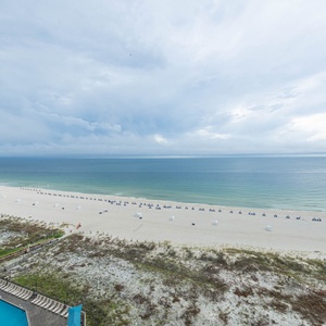 Gaze at the tranquil waters and beach from your spacious balcony, perfect for unwinding and enjoying the view