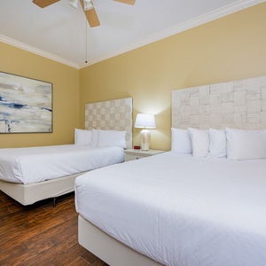 Sleep peacefully in soft, queen beds, surrounded by calming decor for a restful night in this guest suite
