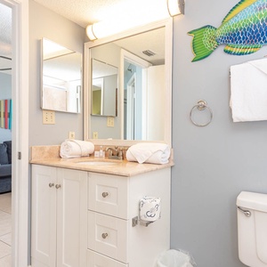 Refresh in the bathroom featuring a walk-in shower, accessible from both the bedroom and living area