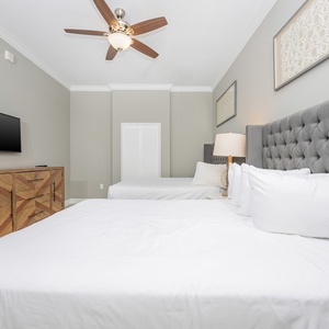 Savor evening relaxation in this inviting guest bedroom, complemented by two queen beds and a soothing atmosphere