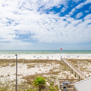 Soak in the bright coastal views from your balcony, watching beachgoers enjoy their sun-kissed adventures