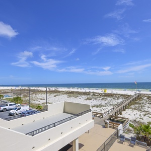 This inviting space features a stunning beachfront view, perfect for relaxing and enjoying the coastal atmosphere