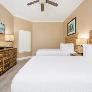 Relax in this inviting queen guest suite with plush bedding and a cozy atmosphere, perfect for restful nights