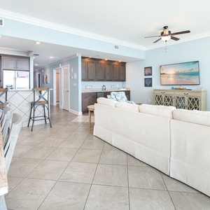 Experience leisurely gatherings in the inviting living space, with plush seating and refreshing coast views all around