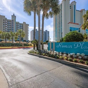 Welcome to Romar Place in Orange Beach, featuring resort amenities, palm trees, beautiful landscaping, directly on the beach