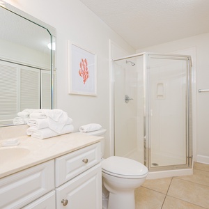 Refresh in this additional guest bath with a walk-in shower and laundry area with a washer and dryer in your rental