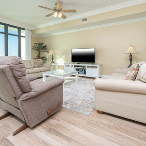 Relax on the cozy sofa with a queen sleeper in this inviting family room with breathtaking beachfront views