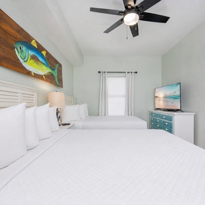 Fresh coastal art brightens the guest suite with two queen beds as you unwind and stream your favorite shows