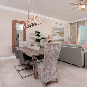 Gather around the modern dining table, enjoying laughter and memories with loved ones in this inviting space