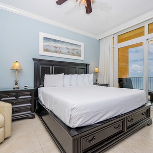 Retreat to the king master suite with cozy bedding and drift off to the sound of the waves from the balcony