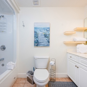 Enjoy a relaxing shower after a day of adventure in this guest bath with stylish accents and fluffy towels
