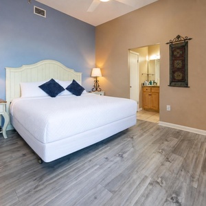 Unwind in the cozy king master suite, bask in comfort, and enjoy the warm glow from the bedside lamp