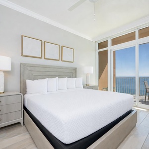 Retreat to the king master suite with cozy bedding and drift off to the sound of the waves from the balcony