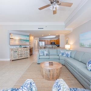 Relax on the plush sofa with a queen sleeper, enjoying family movie nights and coastal decor