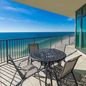 Relax at the table on your balcony, soaking in stunning views and the refreshing vibe of the coast