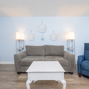 Relax on the sofa with a full sleeper, surrounded by coastal decor, perfect for family game nights or movie marathons