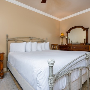Experience restful nights on a king bed, enriched by warm lighting and inviting decor in this cozy guest suite