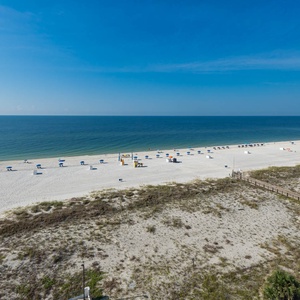 Enjoy breathtaking beachfront views from this inviting balcony, perfect for relaxation and soaking in the coastal atmosphere
