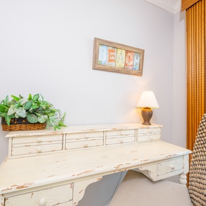 Enjoy family time with coastal decor in the living room with a queen sofa sleeper and cozy workspace