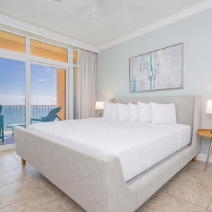 Relax in this inviting master bedroom featuring a king bed and beachfront balcony access