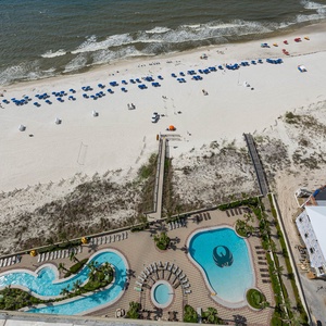 Discover the refreshing pool area with gradual entry, indoor hot tubs and pool, lazy river, and waterslide