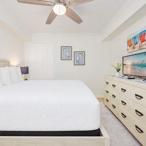 Bright artwork adds a splash of fun as you relax on the queen bed in the guest suite after a day outside