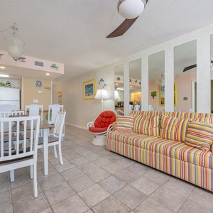 Gather your family in the vibrant living area, enjoying laughter and relaxation on the plush sofa with queen sleeper