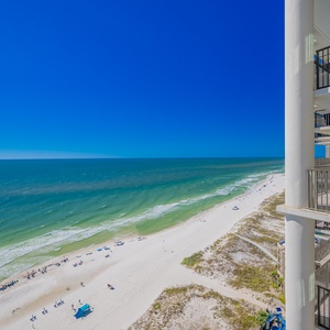 Stunning views of the pristine beach and vibrant blue waters from the balcony of this stunning coastal retreat