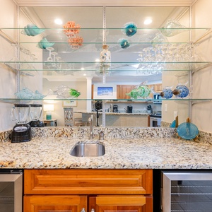 Grab a chilled bottle from the wine cooler or create your favorite cocktail at this elegant wet bar