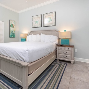 Experience restful nights in the inviting guest bedroom with a king bed, coastal decor, and soothing colors