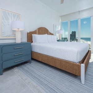 Relax on the cozy king bed in this guest suite and enjoy stunning coastline views