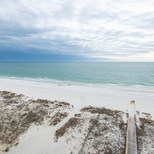 Gaze at the tranquil waters and shoreline while enjoying the refreshing coastal breeze from your retreat