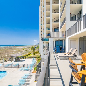 Savor the refreshing beach vibe from your balcony while lounging in comfy seating and taking in scenic coastal views