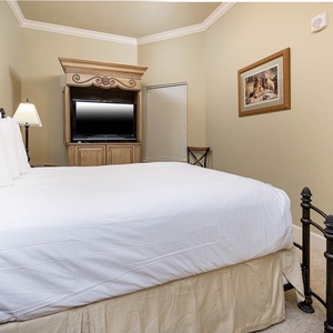 Drift into comfort in this queen guest suite, experiencing tranquility while enjoying a favorite show on the nearby TV