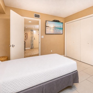 Relax with cozy comfort in this guest suite with a twin bed and bunk with doubles