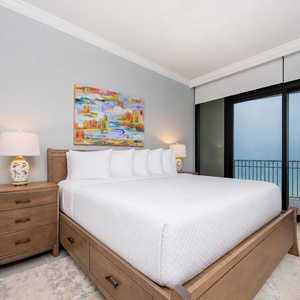 Relax in the master suite featuring a king bed and beachfront balcony access