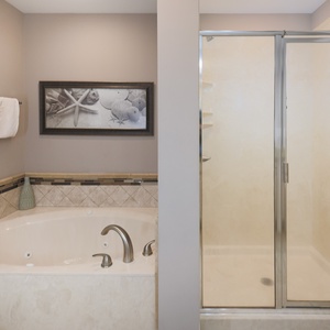Indulge in relaxation in the master bath with a refreshing walk-in shower and soothing jetted tub