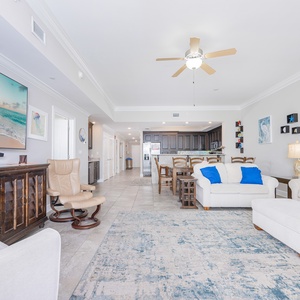 Unwind in the inviting living area, where natural light floods in, creating a warm and welcoming ambiance