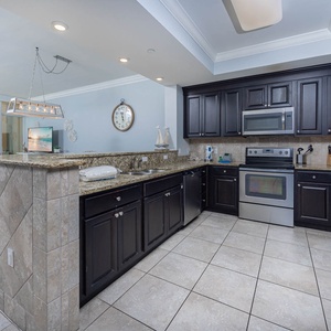 Cook and gather in this inviting kitchen, featuring granite counters and a spacious layout for meal preparation