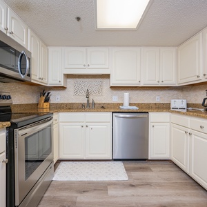 Craft delicious meals in the inviting kitchen, featuring sleek appliances and plenty of counter space for your culinary