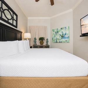 Relax on the cozy king bed in this guest suite and stream your favorite shows after a beach day