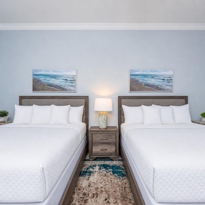 Inviting queen bedroom featuring two comfortable beds, soft linens, and relaxing atmosphere