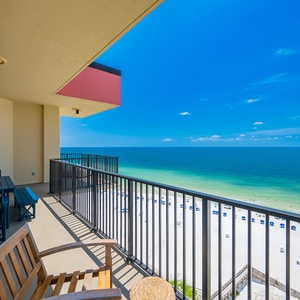 Enjoy the views from the spacious balcony, complete with seating and a stunning beachside panorama