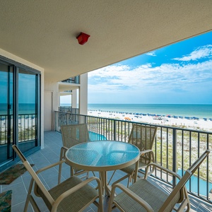 Sip your morning coffee at the outdoor table while enjoying expansive views of the beach and water
